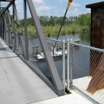 Tammany Trace Trail in Louisiana bike trail crosses bridge over boat